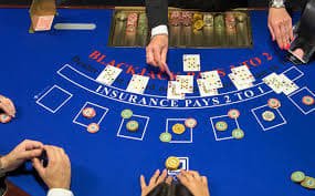 Live casino table with dealer and cards